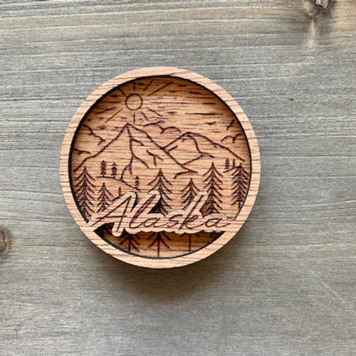 Round Script Alaska Mountain Scene Engraved Wood Magnet
